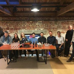 CM and Oliver Knussen with composers all sitting behind a table laid out with drinks