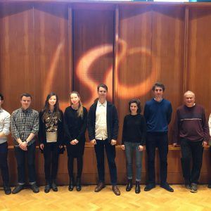 the 8 panufniks composers plus colin matthews lined up together with the LSO logo in the background