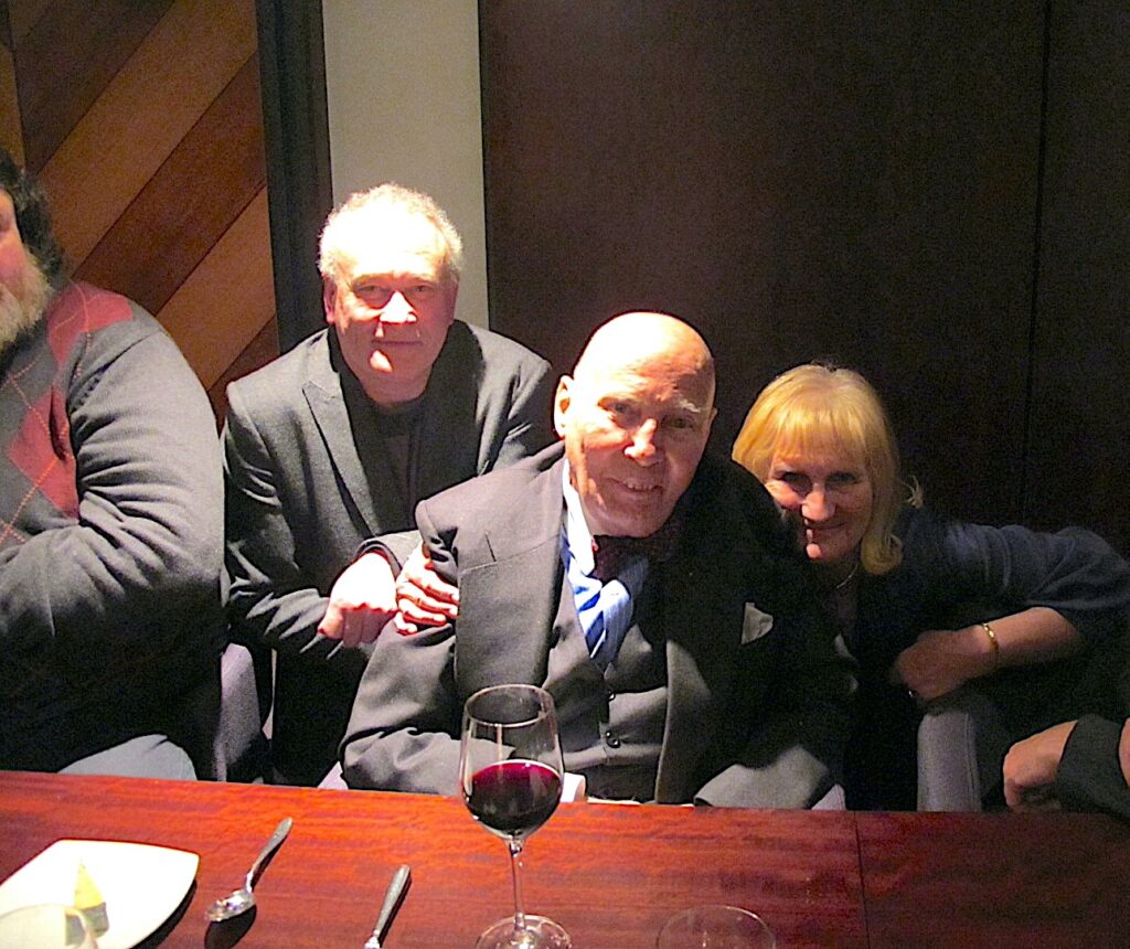 Hans Werner Henze poses for a photo between Colin and Belinda Matthews. Another man (Olly Knussen) is just visible next to Colin.